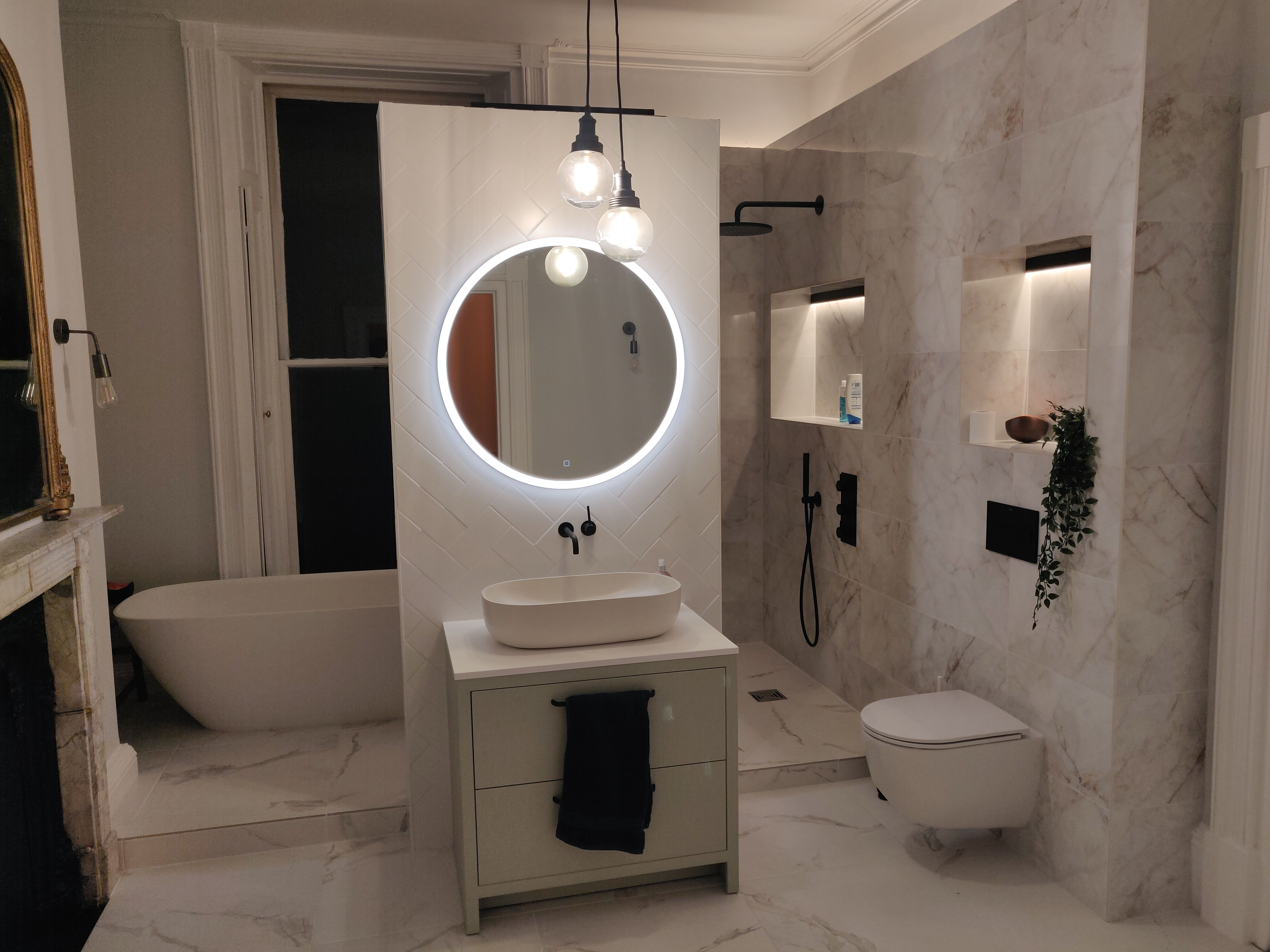 Toilet, sink, and mirror are now complete