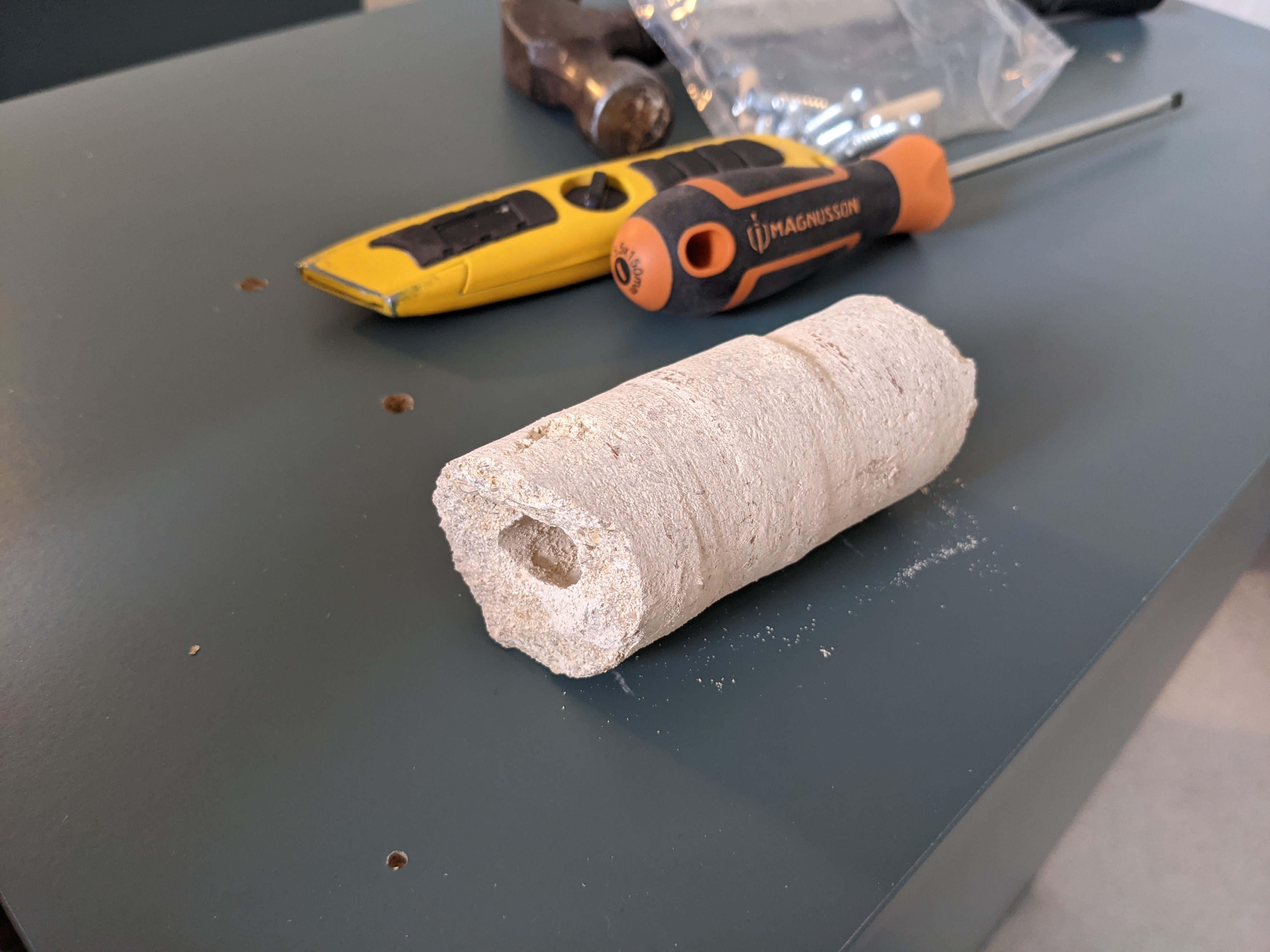 A core sample of the stone of the house (to let the drain out)