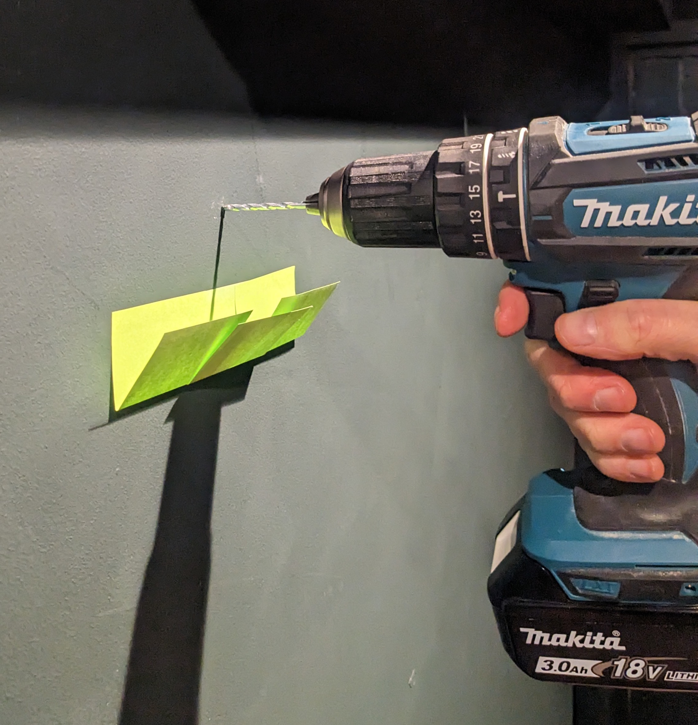 A good tip for keeping mess to a minimum when drilling holes in the wall - Post-its!